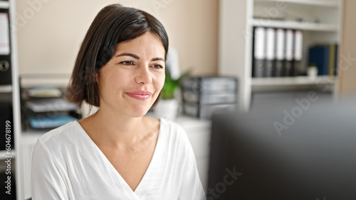 Young beautiful hispanic woman business worker using computer working at office