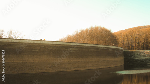 Water dam with two people walking