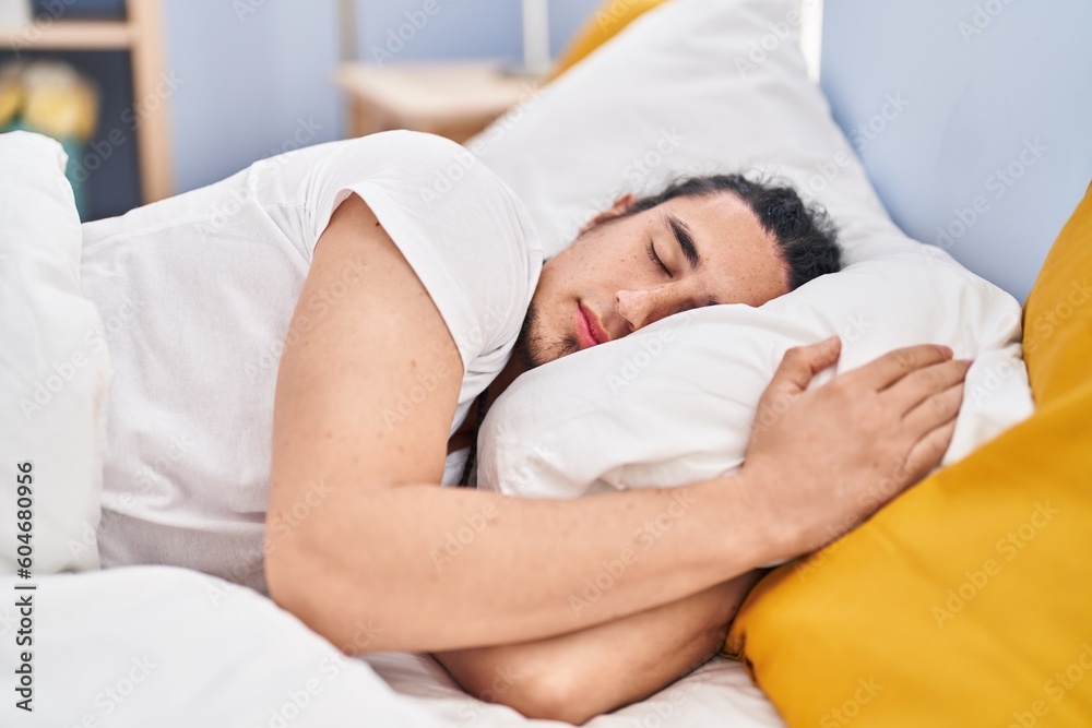 Young man sleeping on bed at bedroom Young man sleeping on bed at bedroom