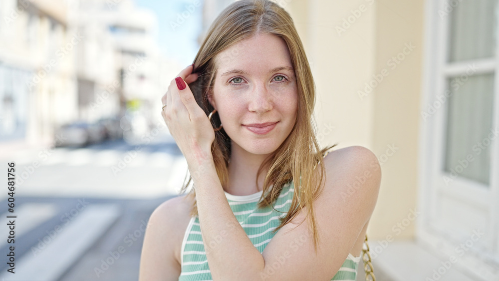 Young blonde woman smiling confident standing at street Young blonde woman smiling confident standing at street