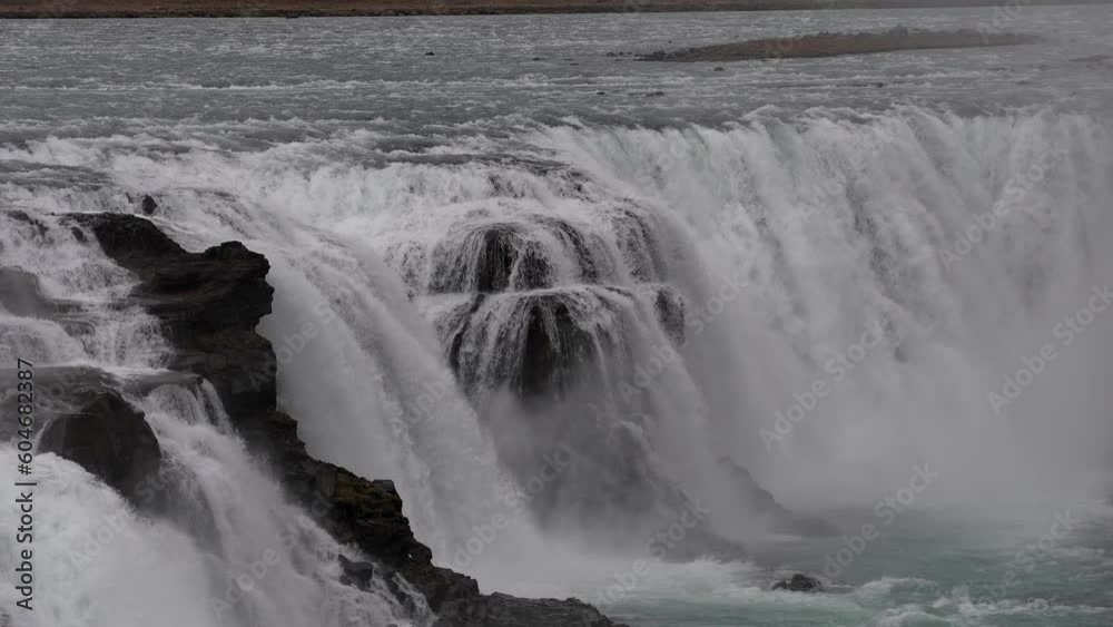 Golden waterfall (Gullfoss falls in Icelandic language). 4K close up video with this landmark waterfall during a cloudy day in Iceland. Golden waterfall (Gullfoss falls in Icelandic language). 4K close up video with this landmark waterfall during a cloudy day in Iceland.