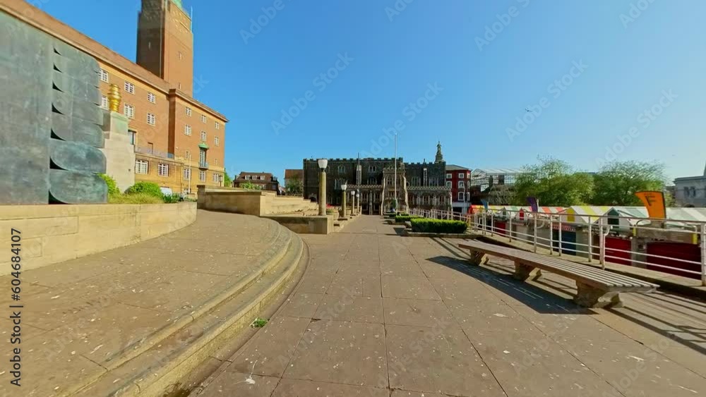 Panning shot of the War Memorial Garden above the outdoor market in the city of Norwich. Captured on a bright and sunny morning Panning shot of the War Memorial Garden above the outdoor market in the city of Norwich. Captured on a bright and sunny morning