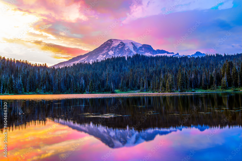 Colorful mountain sunset in mountain over a lake