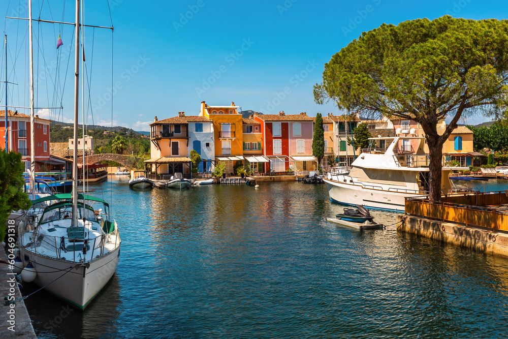 Yachts on the canal and colorful houses in Port Grimaud, France.