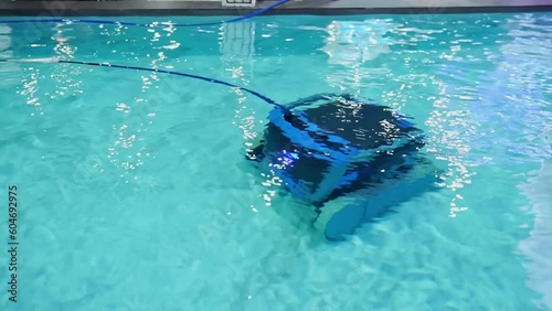 robot pool cleaner. Pool maintenance with automatic robot. Summer pool cleaning robot before swimming. cleaner the bottom of the pool and walls with a submersible robot.