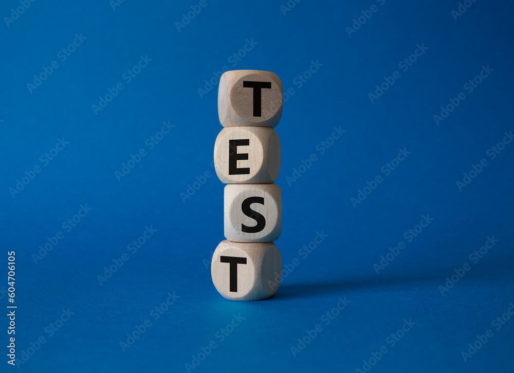 Test symbol. Concept word Test on wooden cubes. Beautiful blue background. Business and Test concept. Copy space. Test symbol. Concept word Test on wooden cubes. Beautiful blue background. Business and Test concept. Copy space.