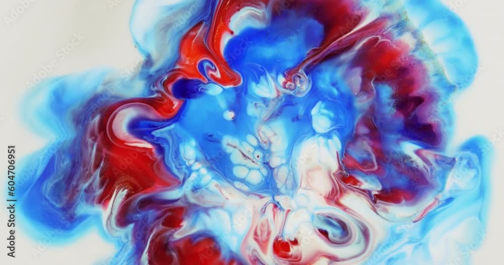 On a white background, a divergent blurry circle of red, white, blue flowers with a glow. Abstract art