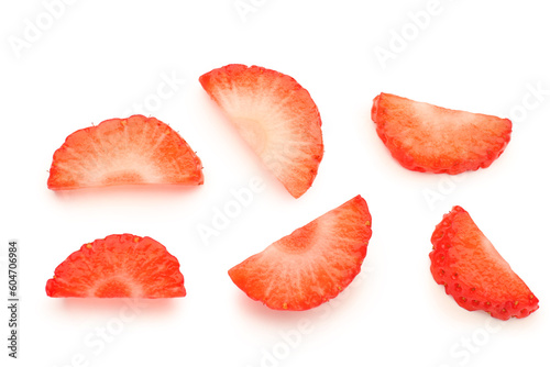 Slices of fresh strawberries on white background