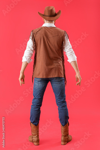 Handsome cowboy on red back...