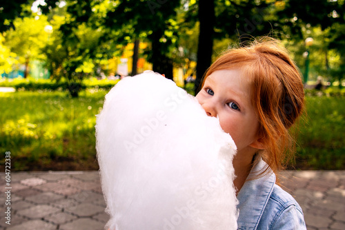 Wallpaper Mural girl eats candy floss in the park Torontodigital.ca