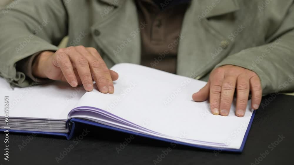 Blind person reading a book Blind person reading a book