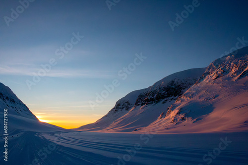 Sunrise at Kungsleden skiing trail near Viterskalet Mountain hut, Lapland, Sweden 