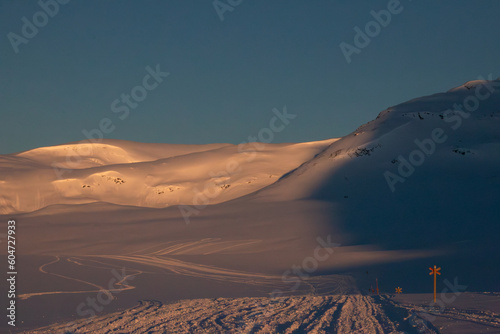 Kungsleden skiing and snowmobile trail between Viterskalet and Syter Mountain Huts in March, Lapland, Sweden photo