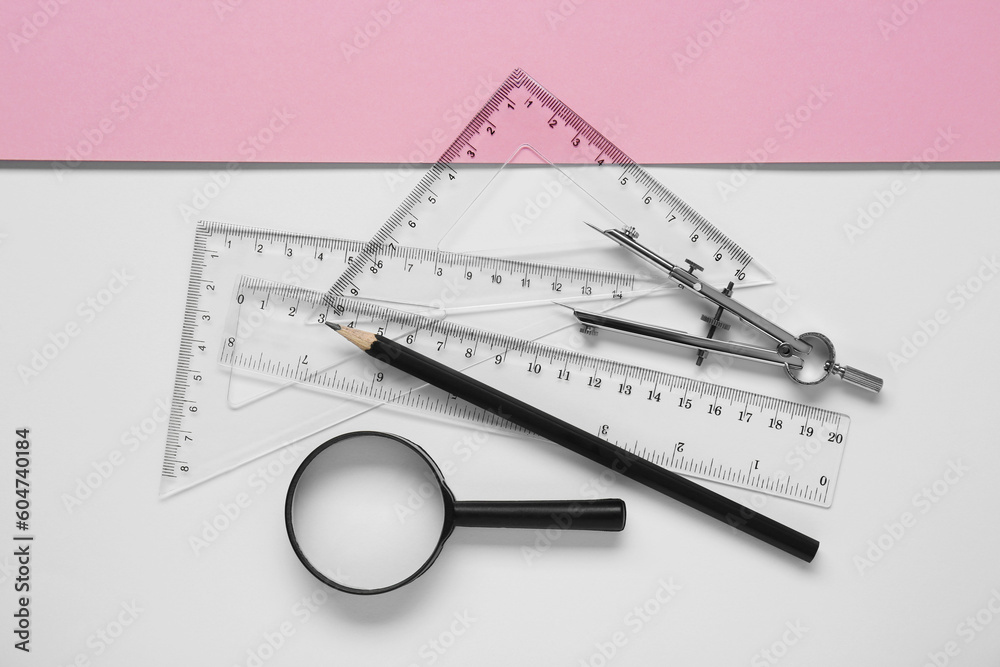 Flat lay composition with different rulers, pencil and compass on color background Flat lay composition with different rulers, pencil and compass on color background