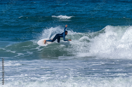 Surfer riding waves in Furadouro Beach