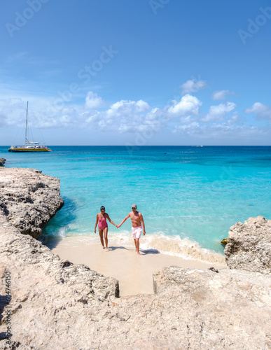 Wallpaper Mural Tres Trapi Steps Triple Steps Beach, Aruba, Popular beach among locals and tourists for diving and snorkeling, couple man and woman in a crystal clear ocean in the Caribbean  Torontodigital.ca