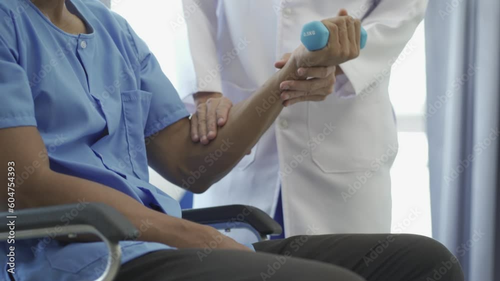 Sports physiotherapy close up hands of asian male doctor physiotherapist patient with musculoskeletal injury training walking on walker or walking stick at home