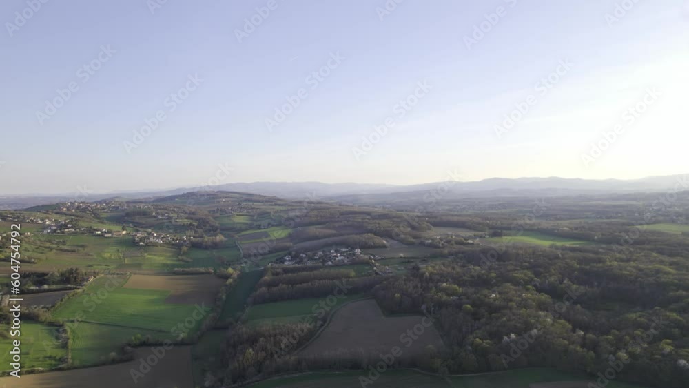 Panorama Of A Non-Urban Landscape With Settlements And Farmland Near Lyon, Auvergne-Rhone-Alpes, France. Aerial Drone Shot Panorama Of A Non-Urban Landscape With Settlements And Farmland Near Lyon, Auvergne-Rhone-Alpes, France. Aerial Drone Shot