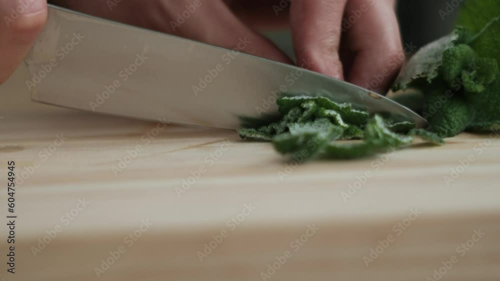 Man Cutting Mint Leafs for Preparing a Mojito or a Cocktail. Close-up bokeh of a Hand. Shot on Super-Takumar f. 2.0 Man Cutting Mint Leafs for Preparing a Mojito or a Cocktail. Close-up bokeh of a Hand. Shot on Super-Takumar f. 2.0