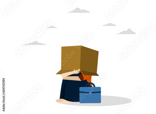 Business failure, bankruptcy or failed entrepreneur concept, work mistake or bad luck, depressed businesswoman sitting covering her head with box, ashamed because she can't face people or society.