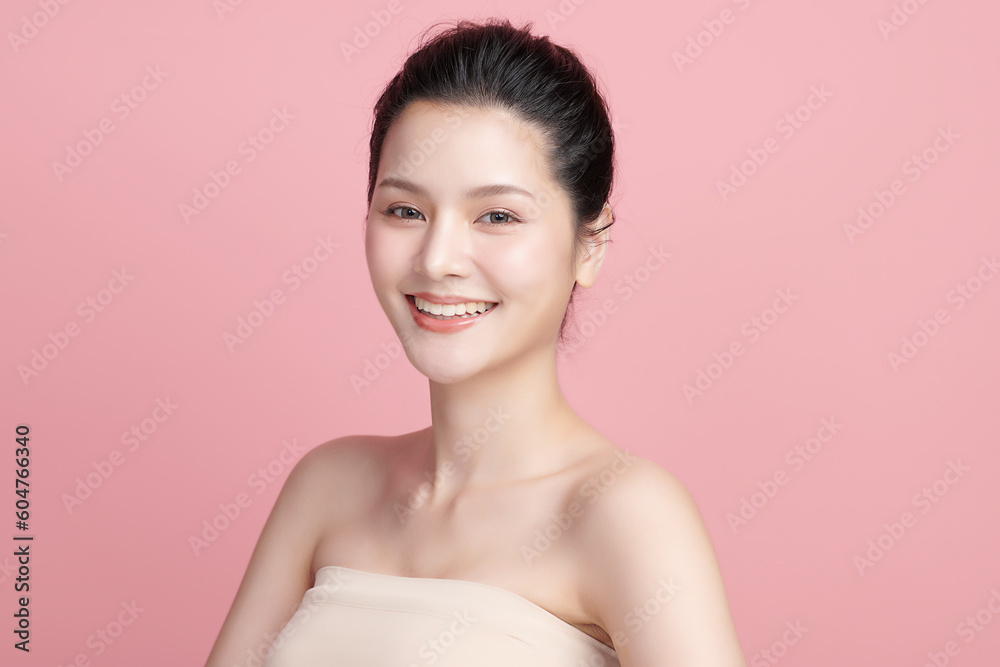 Beautiful young asian woman with clean fresh skin on pink background, Face care, Facial treatment, Cosmetology, beauty and spa, Asian women portrait.