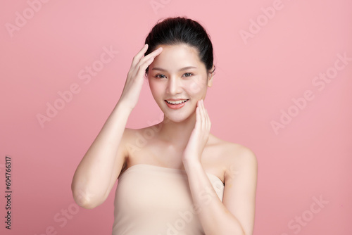 Beautiful young asian woman with clean fresh skin on pink background, Face care, Facial treatment, Cosmetology, beauty and spa, Asian women portrait.