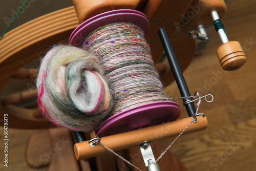 Canvas Print Closeup detail of a bobbin full of colourful organic natural handspun and handdy