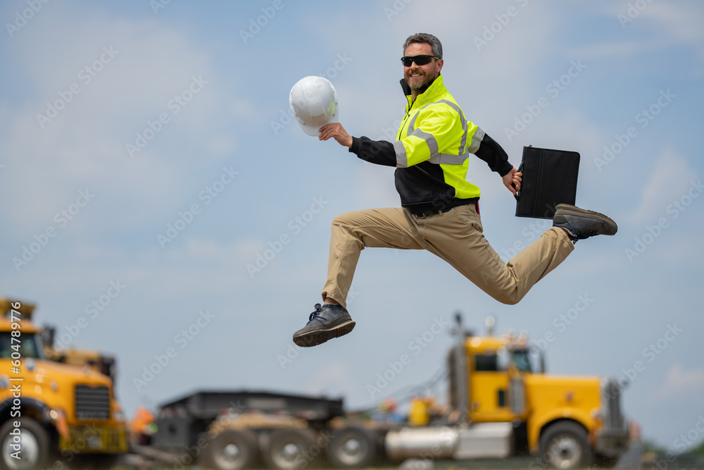 Crazy builder excited jump on site construction. Excited builder ...