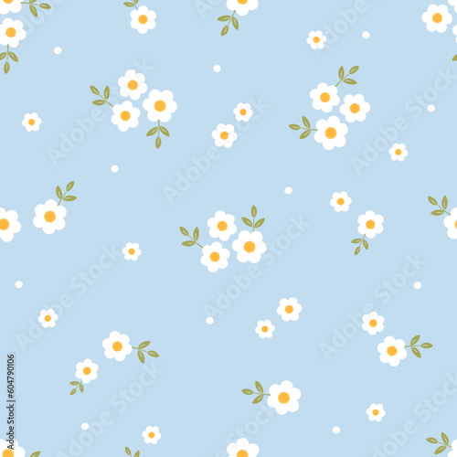 Seamless pattern with daisy flower with green leaves on blue background vector.