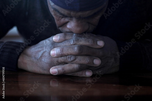 praying to god with hands together with people stock photo