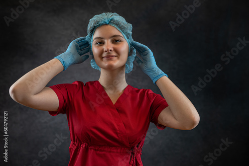 Attractive female nurse or doctor in lab coat isolated