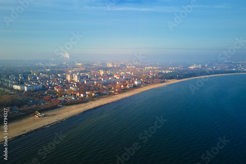 Sea shore with view of Gdansk city, aerial view. Baltic Sea in Poland. Beautiful natural landscape with sea beach coastline