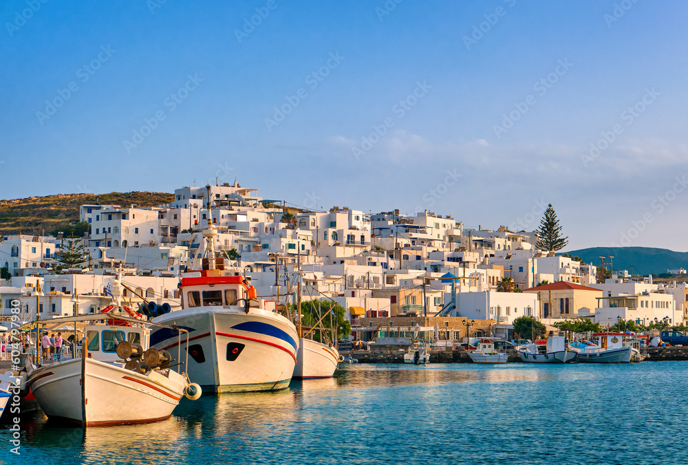 Traditional Greek fishing village and harbour on sunny evening or
