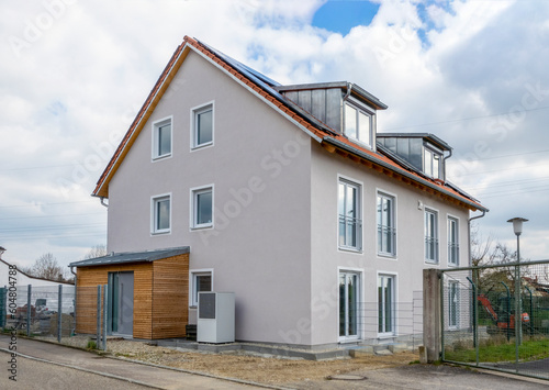 Germany, Bavaria, Odelzhausen, Exterior of modernsingle-familyhouse with shed and heat pump photo