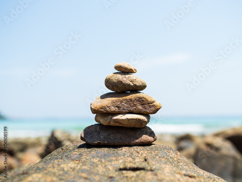 Stack Stone Pebble Growth on Blur Sea Background,Concept Spiritual Stability Zen