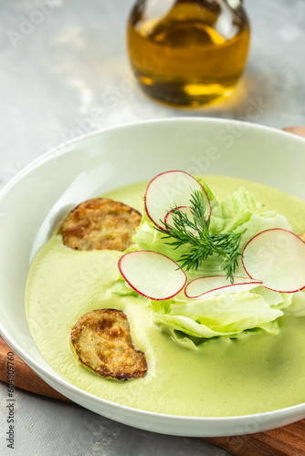 Creamy zucchini soup, vertical image. top view. place for text