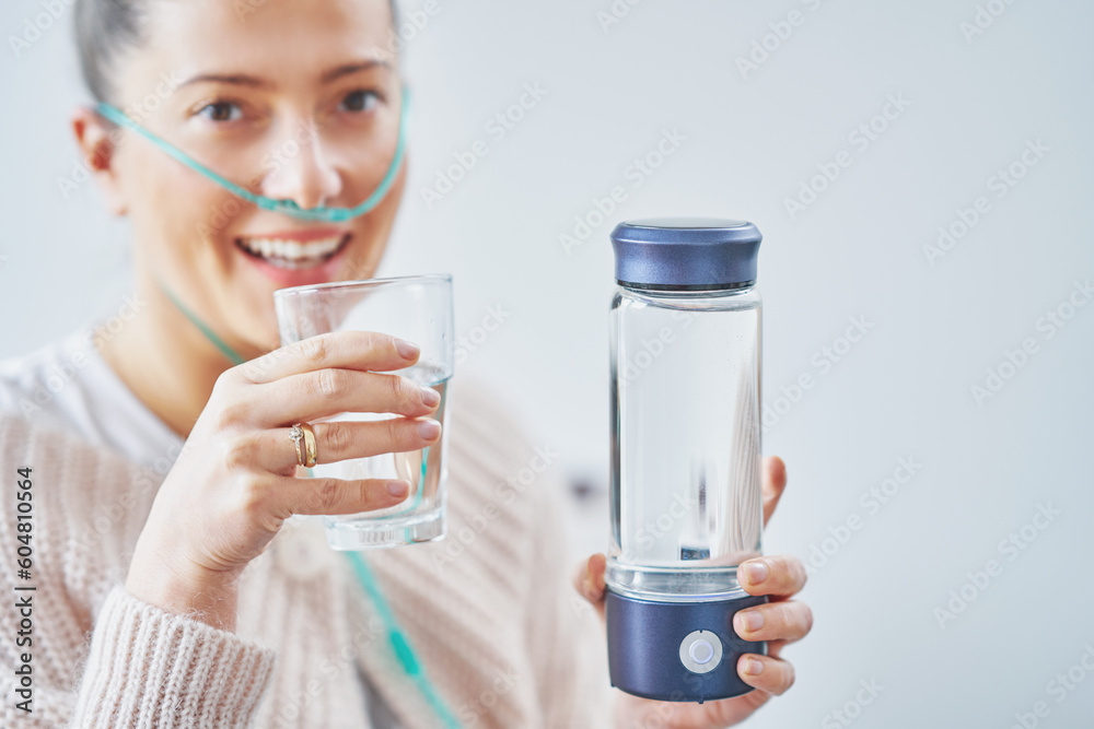 Picture of woman having hydrogen water in hand Picture of woman having hydrogen water in hand