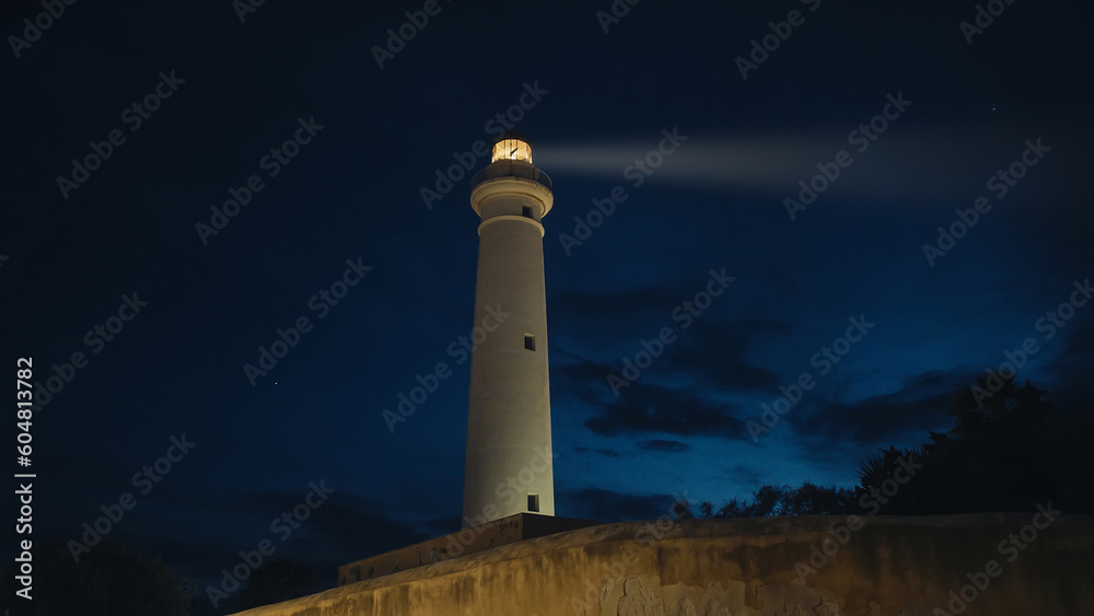 Lighthouse near the moon in the ngiht