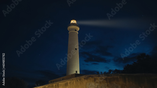 Lighthouse near the moon in the ngiht