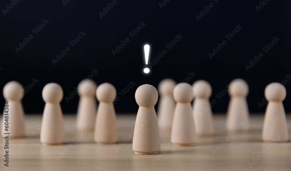 wooden block people show an exclamation mark.
wooden block people show an exclamation mark.
