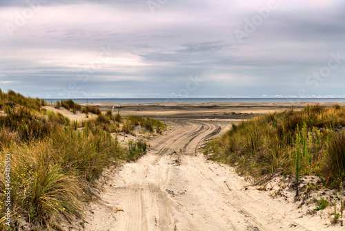 Access to a wide sandy beach  right through the dunes