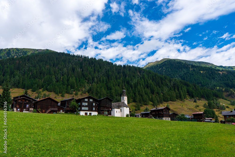 Ancient wooden traditional Swiss granaries and chalets on stone piles in an old abandoned village in Switzerland in mountains