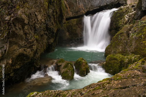 Waterfall with mossy rocks in mountain canyon, Svrakava waterfall near Banja Luka