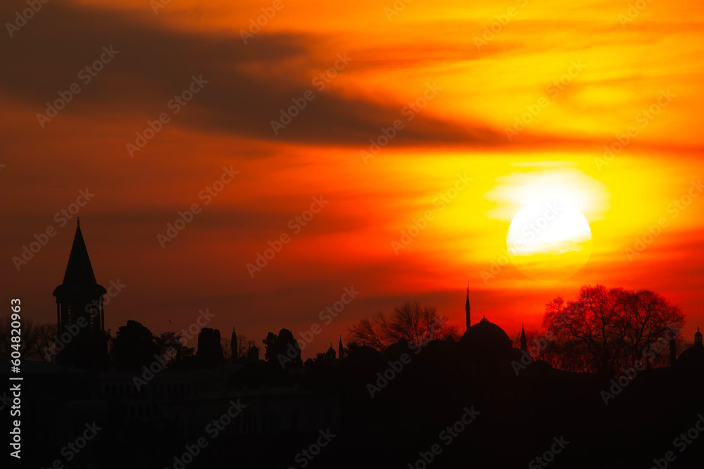 Fototapeta premium Mosque minaret silhouette at sunset time.