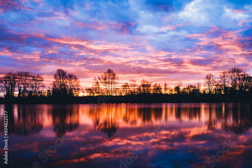 Nightscape photo at Adour French river in blazing red sunset