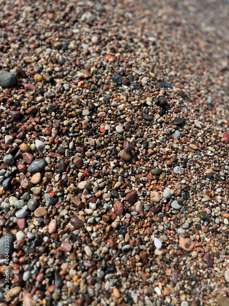 Natural sea pebbles, wet pebbles, small pebble background