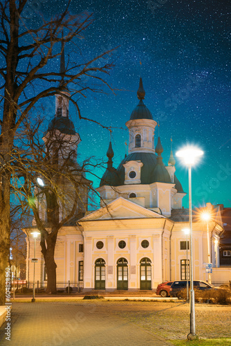 Parnu, Estonia. Night View Of Estonian Apostolic Orthodox Parnu Transformation Of Our Lord Church In Evening Night Illuminations. Famous Attraction Landmark. Bold Bright Blue Starry Sky. Travel.