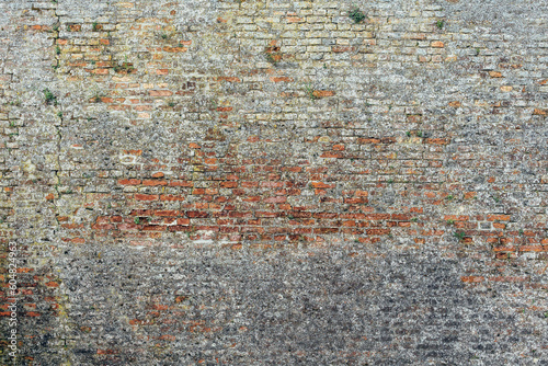 Background of an old worn large brick wall texture