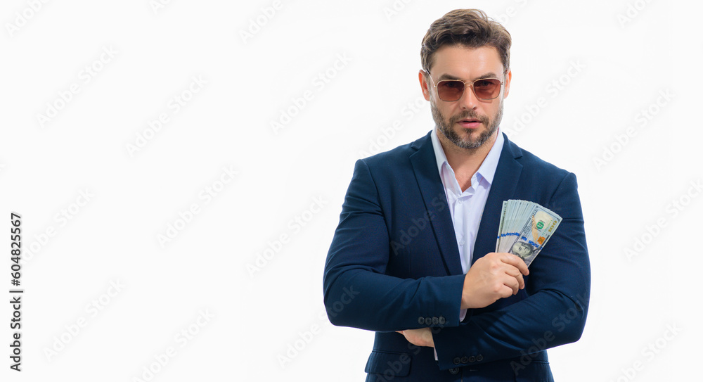 Man in suit with money cash. Dollar banknotes. Portrait of man holding american money banknotes. Dollar bills, credit, online banking. Rich man point at dollar banknotes, bank loan, financial savings. Man in suit with money cash. Dollar banknotes. Portrait of man holding american money banknotes. Dollar bills, credit, online banking. Rich man point at dollar banknotes, bank loan, financial savings.
