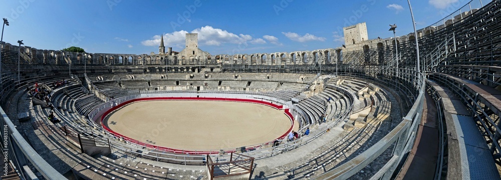 Arles, May 2023 : Visit the beautiful city of Arles en Provence - Historical city with its arena and ancient theater - View on the arena - obrazy, fototapety, plakaty 